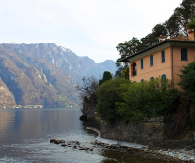 a large body of water with a house on the side of it