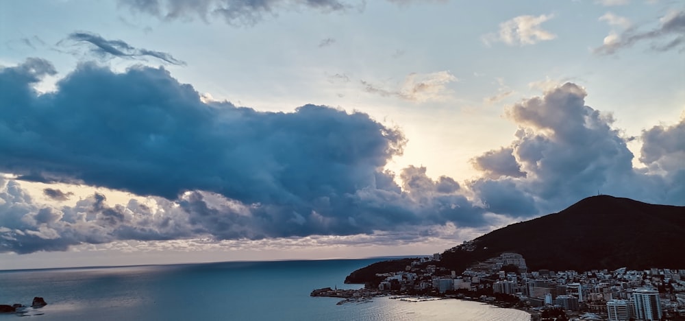 a large body of water under a cloudy sky