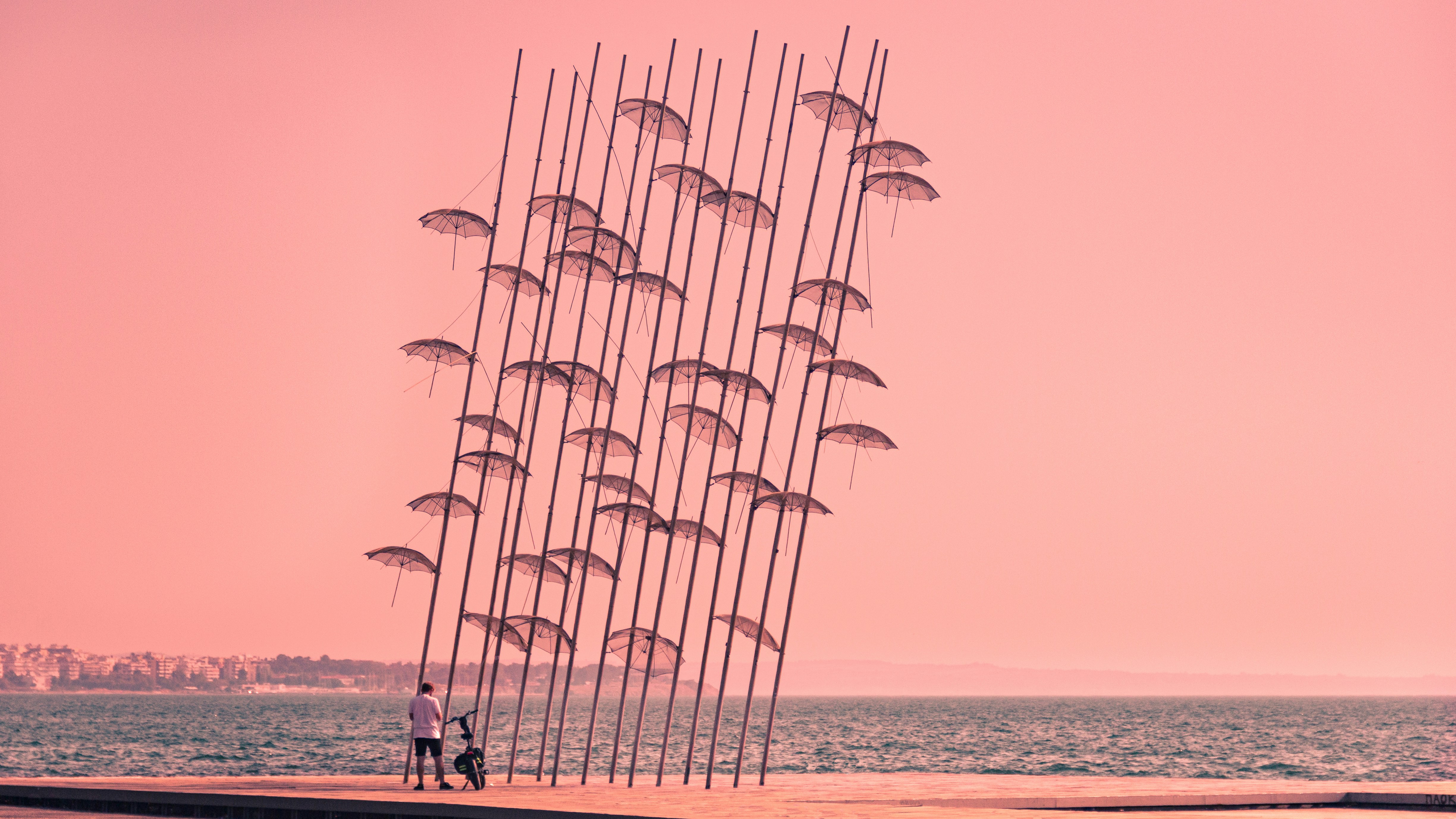 a man is flying a kite on the beach