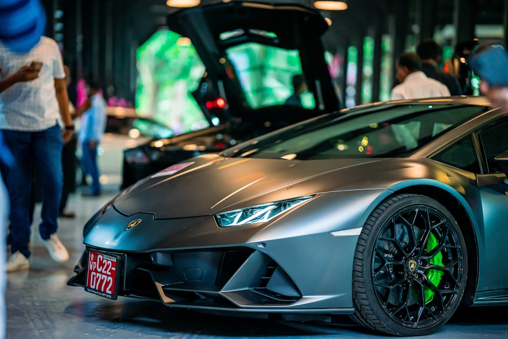 a silver sports car parked in a garage