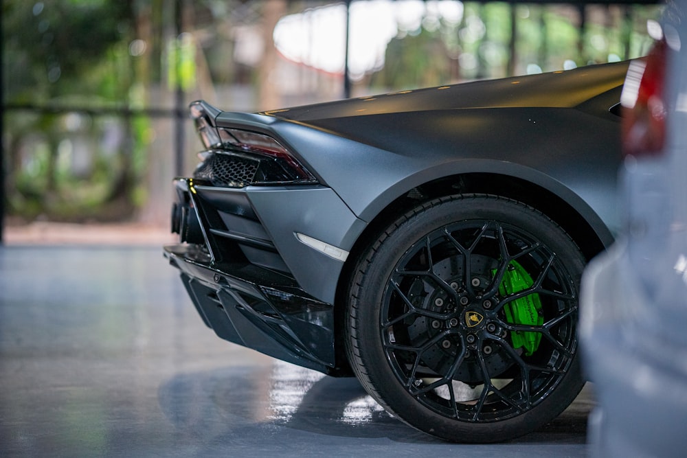 a close up of a sports car parked in a garage