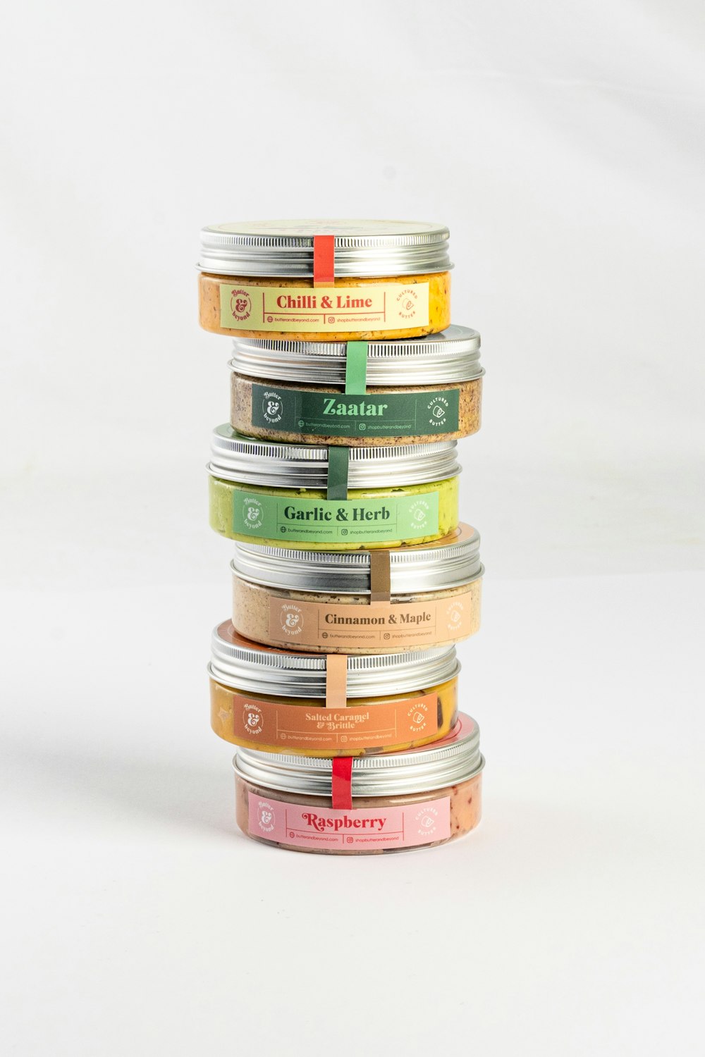 a stack of tins with labels on them