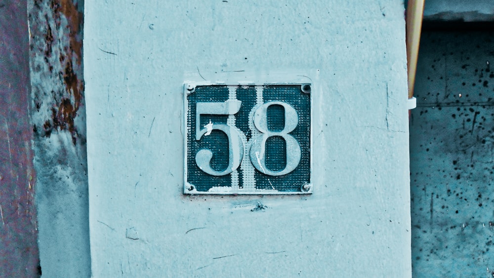 a number sign on the side of a building
