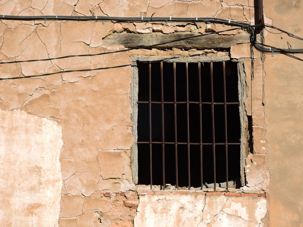 a jail cell with bars on the outside of it