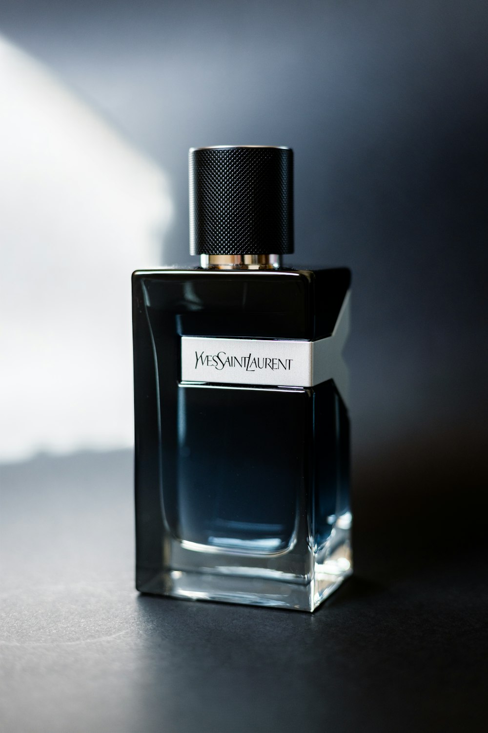 a bottle of perfume sitting on a table