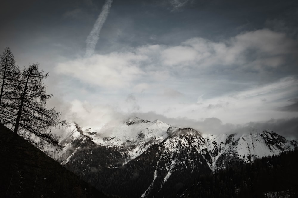 a plane is flying over a mountain range