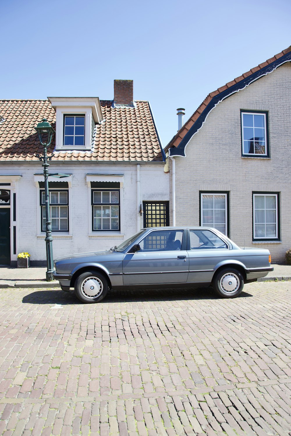 a car is parked in front of a house