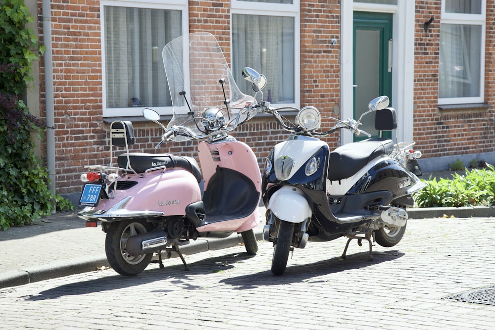 a couple of scooters parked next to each other