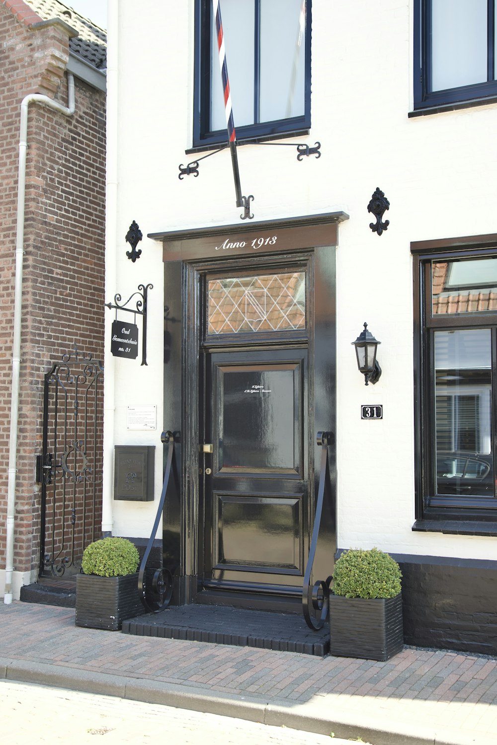 the front of a building with a black door