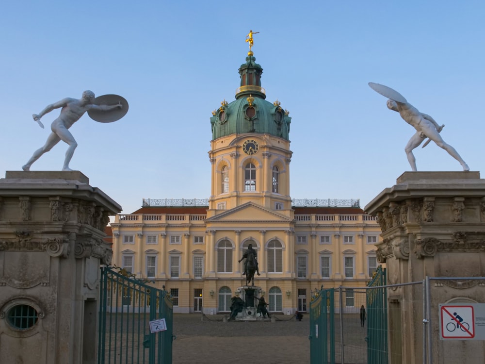 a large building with a tall tower with a clock on it