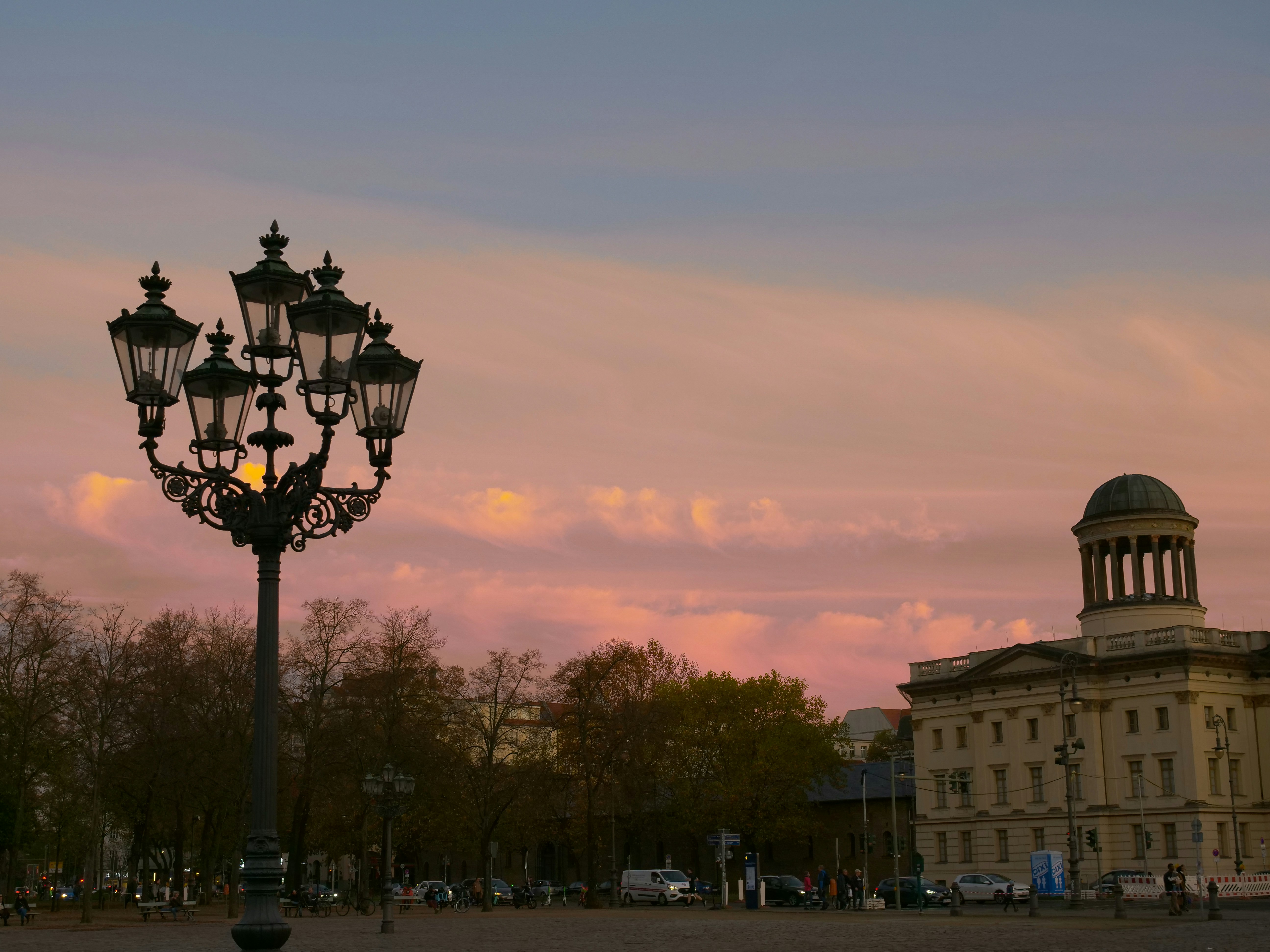 a street light with a building in the background, 