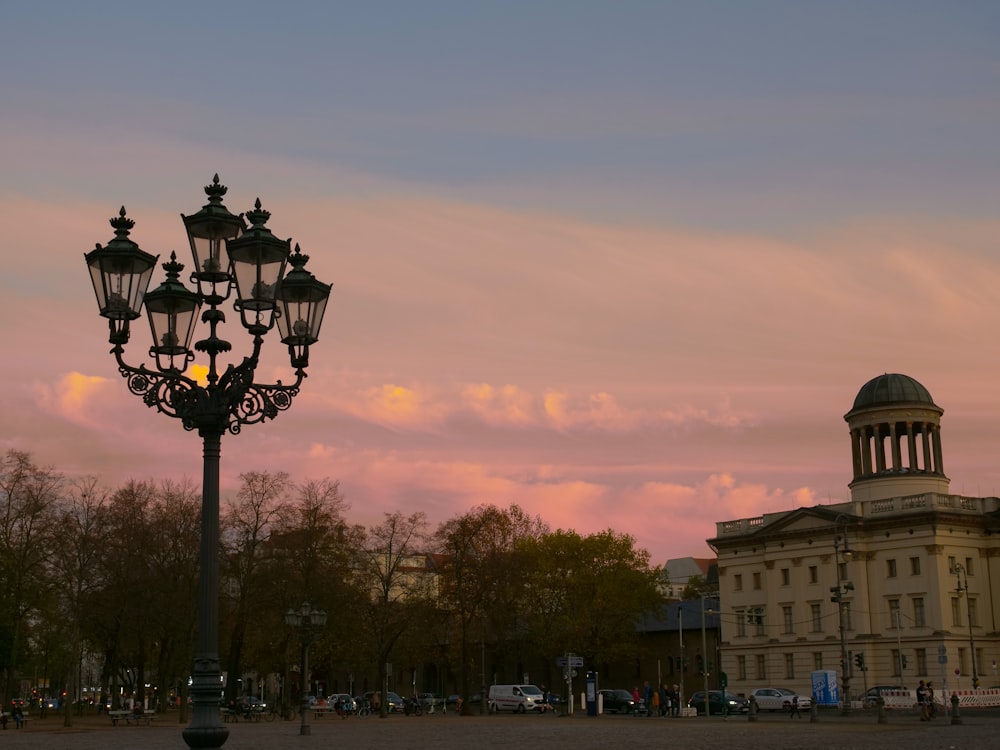 a street light with a building in the background