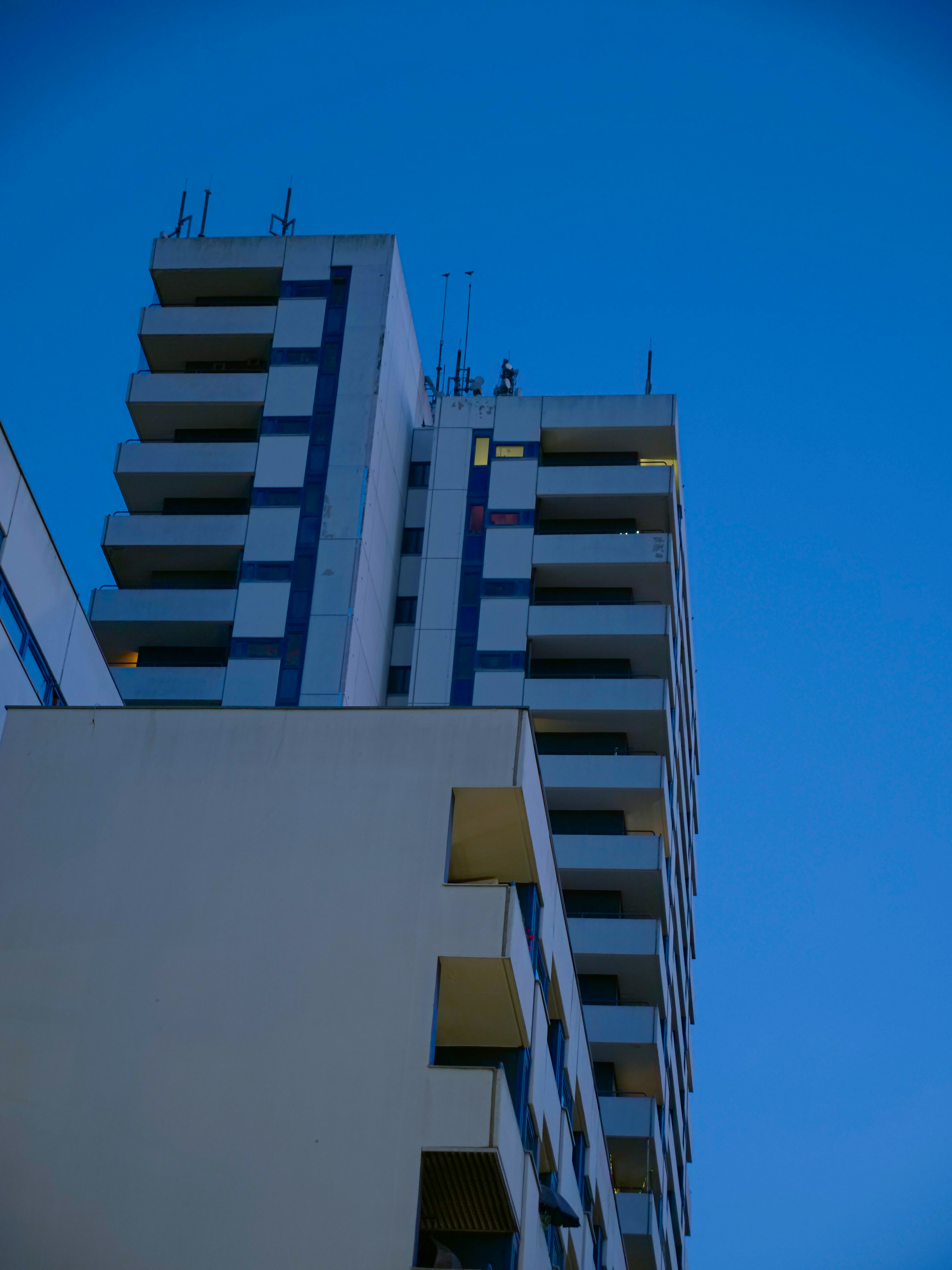a very tall building with a clock on it's side