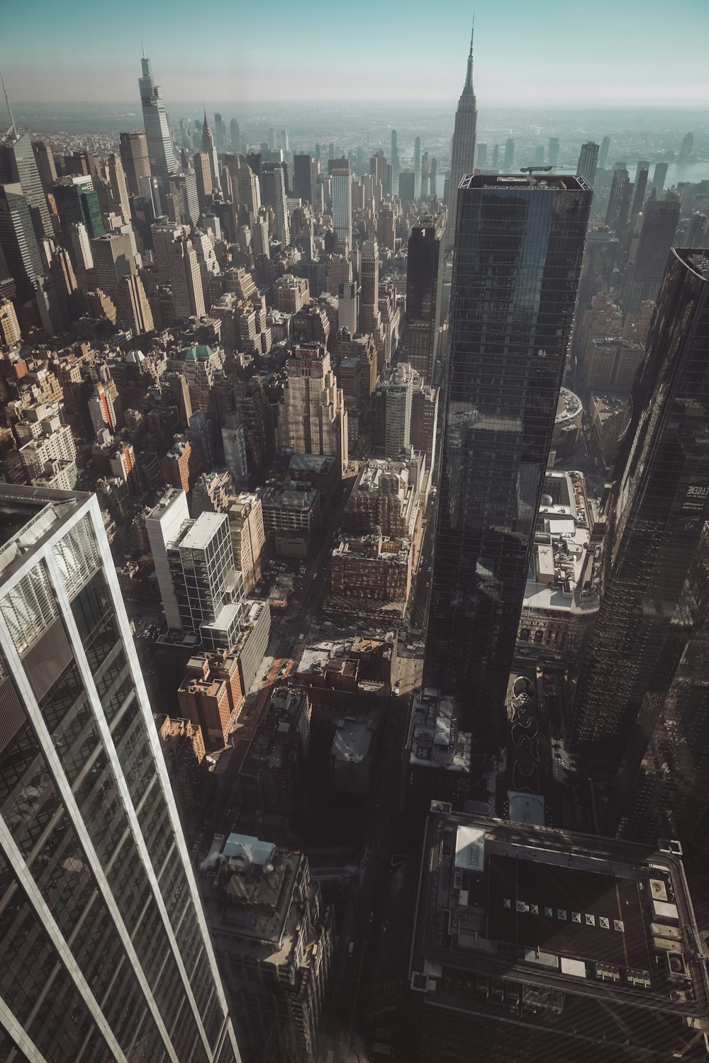 an aerial view of a city with tall buildings