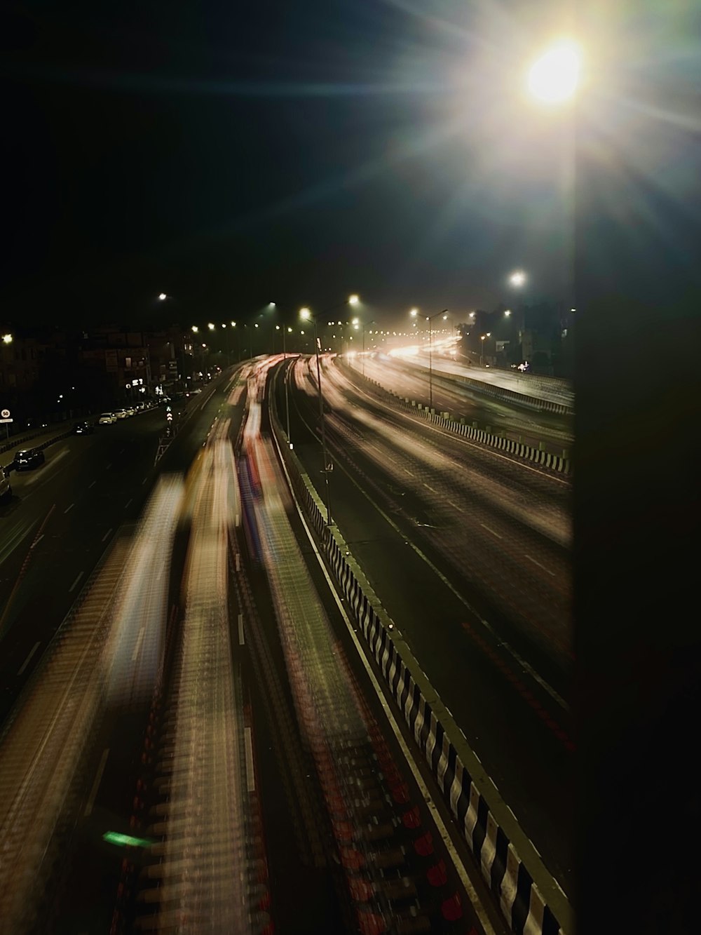 a blurry photo of a highway at night