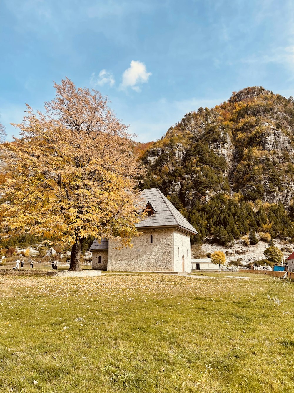 a small house in the middle of a field