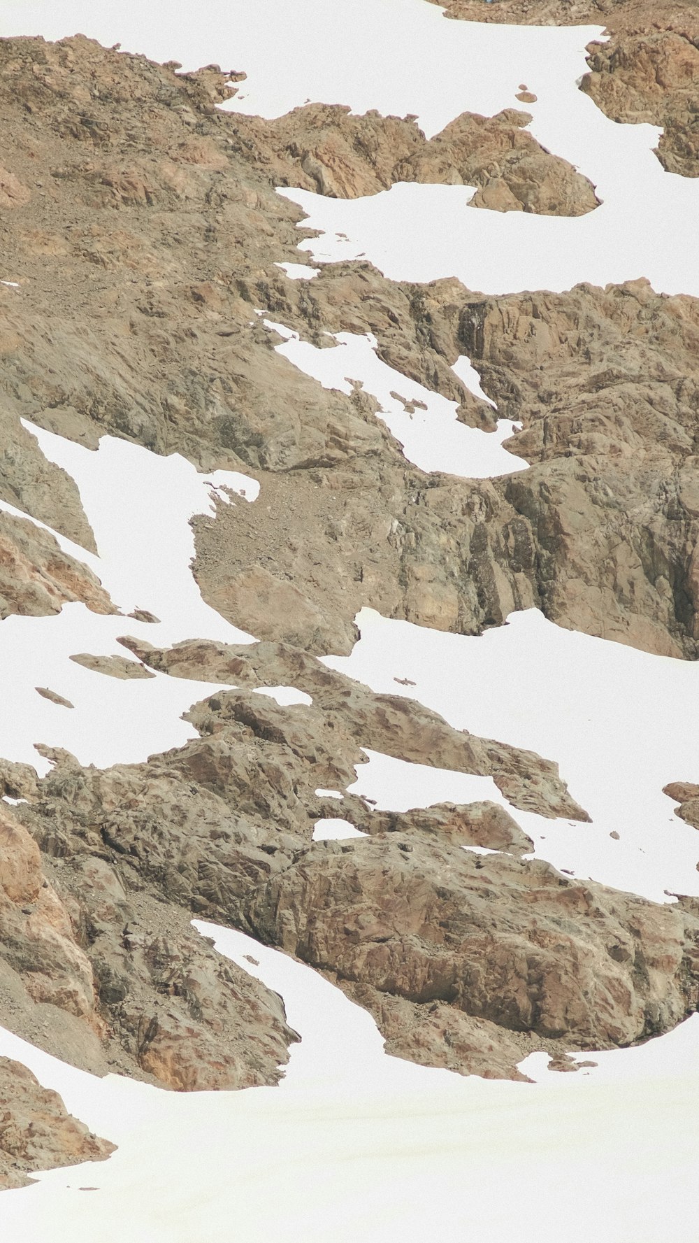 a man riding skis down a snow covered slope