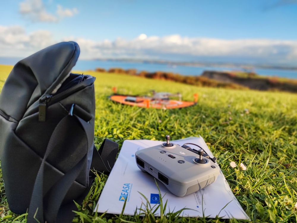 a video game controller sitting on top of a piece of paper