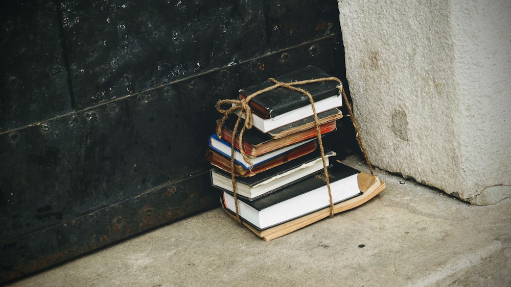 a stack of books sitting on top of each other