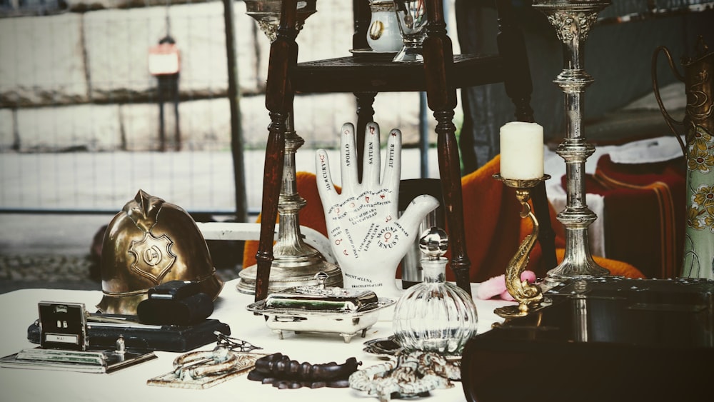 a table topped with lots of different types of jewelry