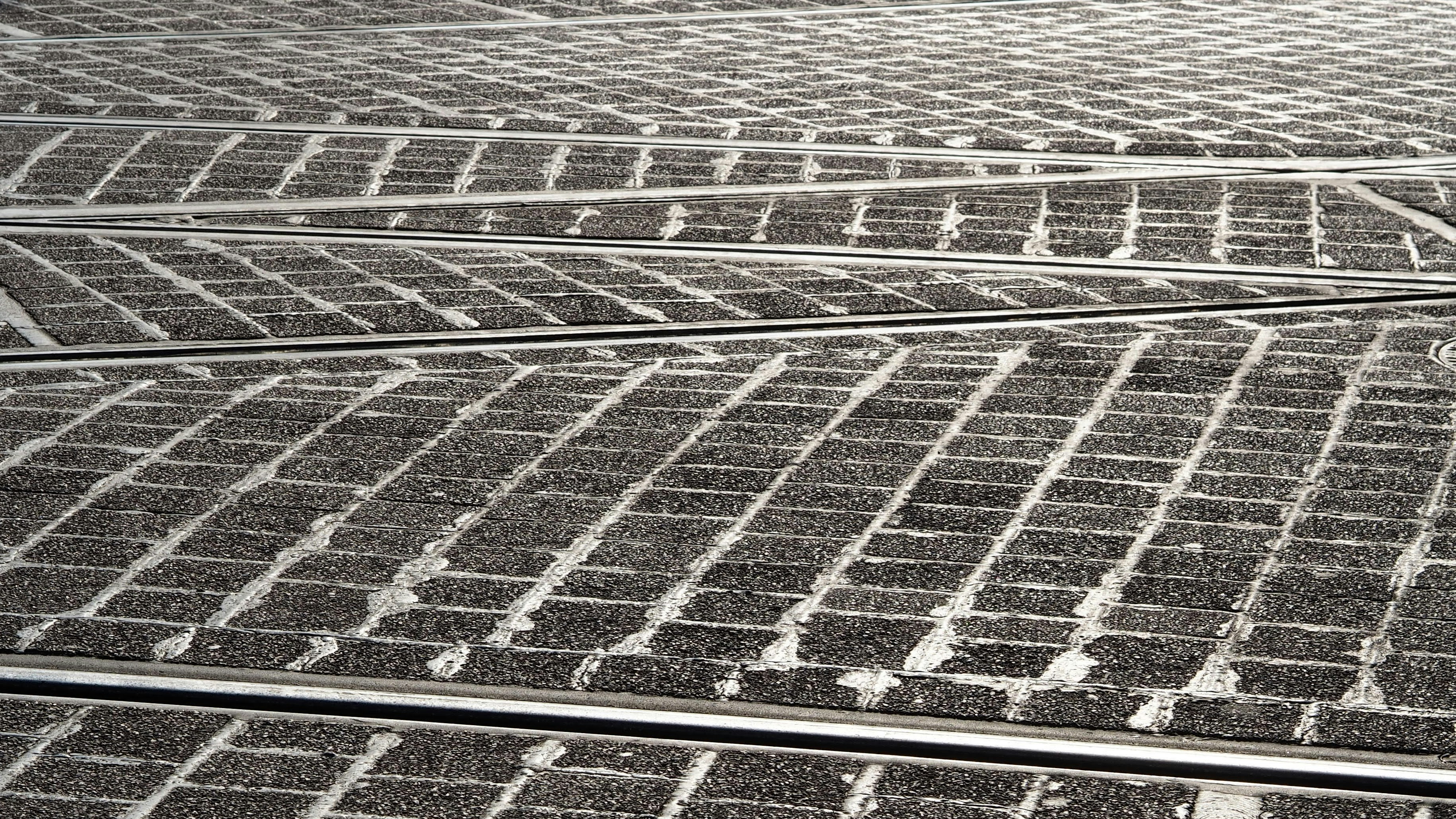 a black and white photo of a train track
