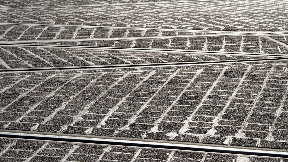 a black and white photo of a train track