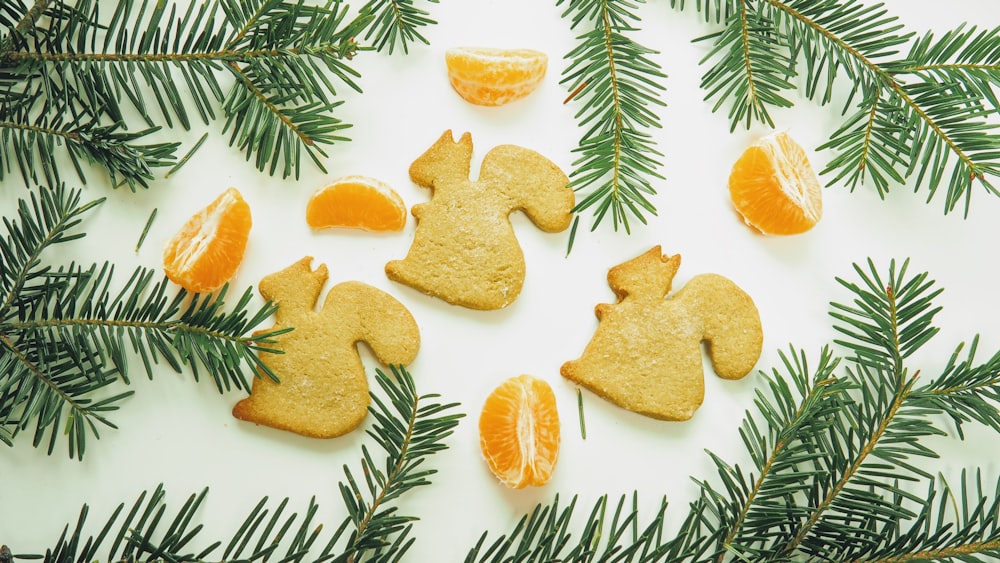 a white table topped with orange slices and cookies