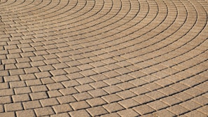 A beautifully paved driveway showcasing intricate block designs.