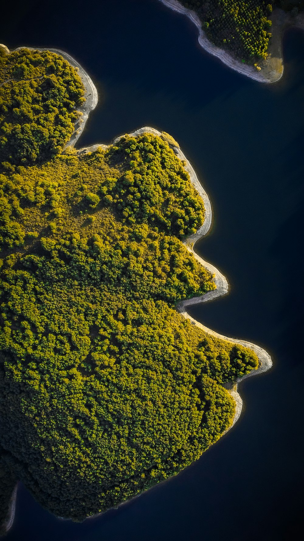 an aerial view of a body of water surrounded by land