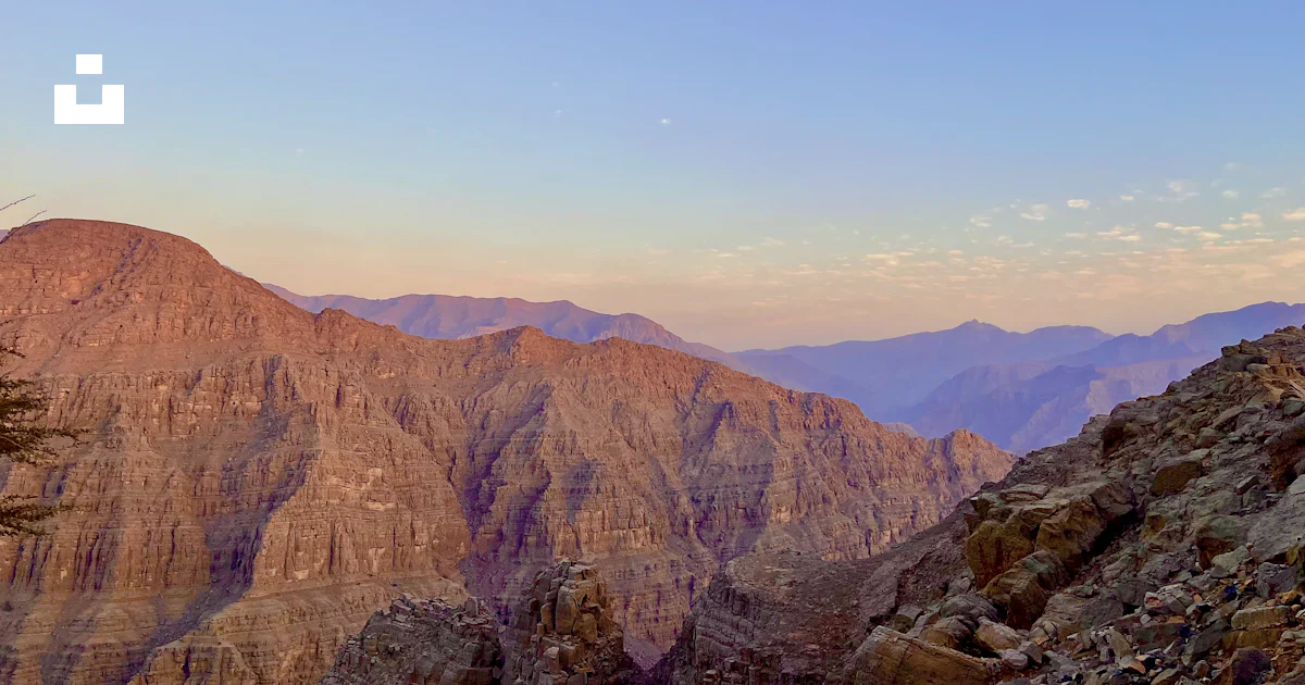 Arabian Ranges Photos A view of a mountain range with a few trees in the foreground photo ...