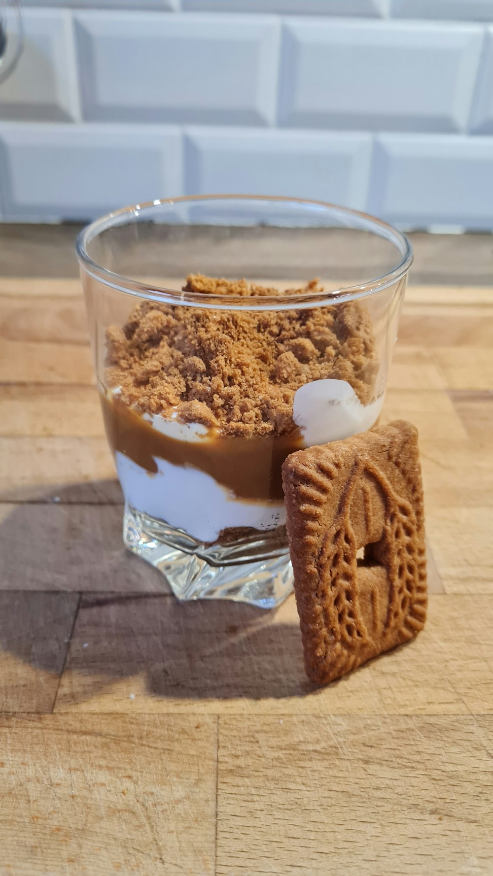 a glass with some food in it on a table