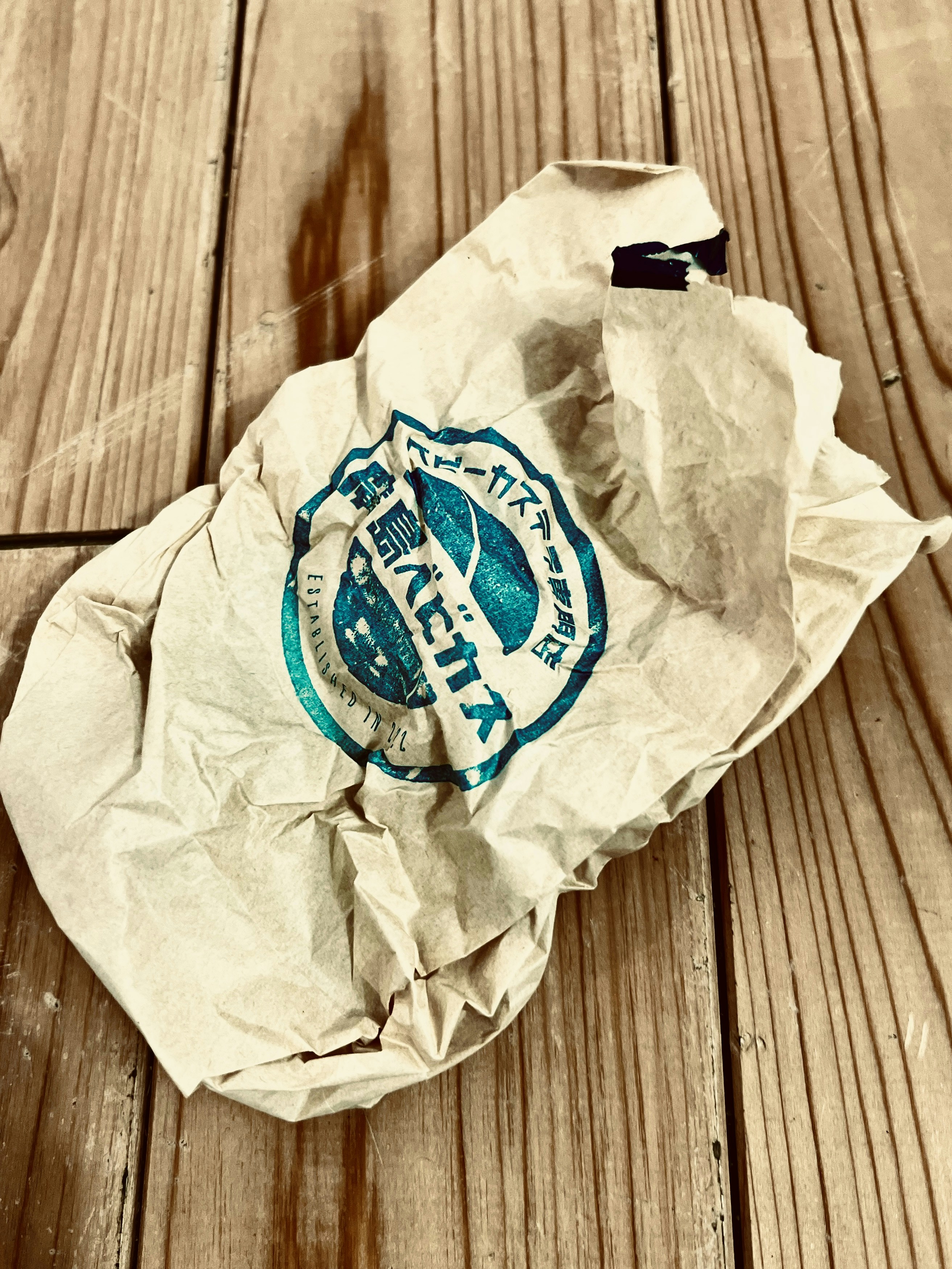 a piece of paper sitting on top of a wooden floor