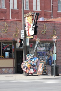 a street sign that has a guitar on it