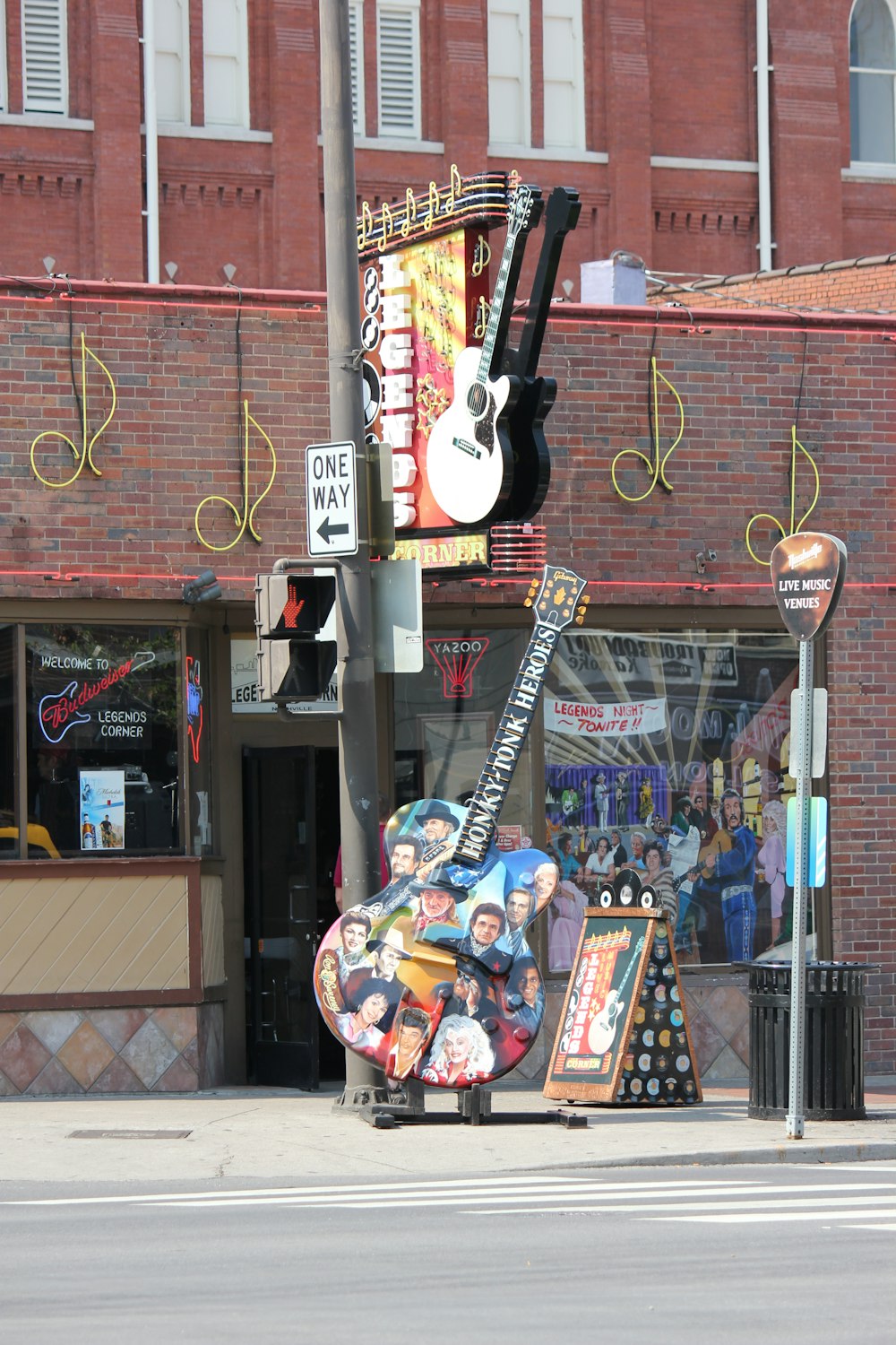 a street sign that has a guitar on it