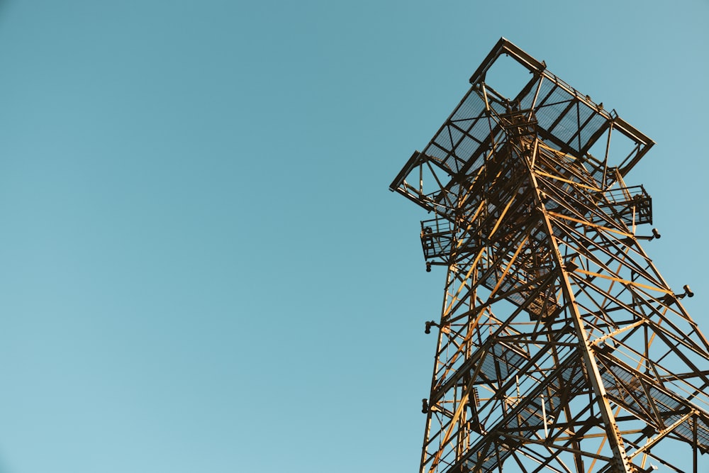 a tall metal structure with a sky in the background