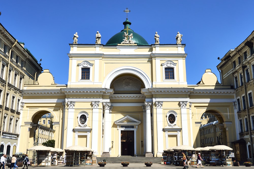 a large church with a green dome on top of it