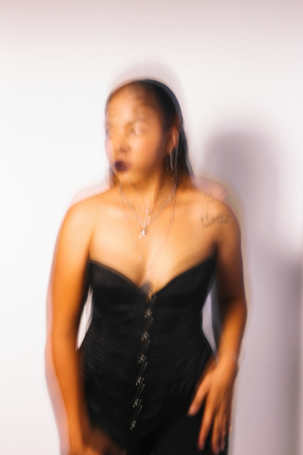 a woman in a black corset posing for a picture