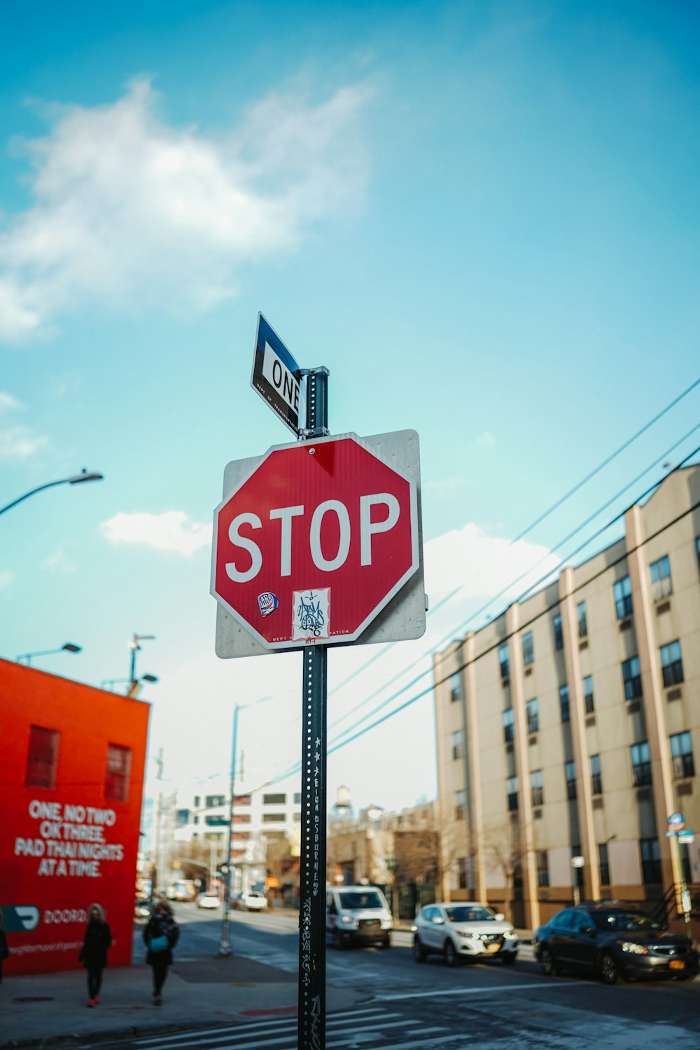 a red stop sign sitting on the side of a road