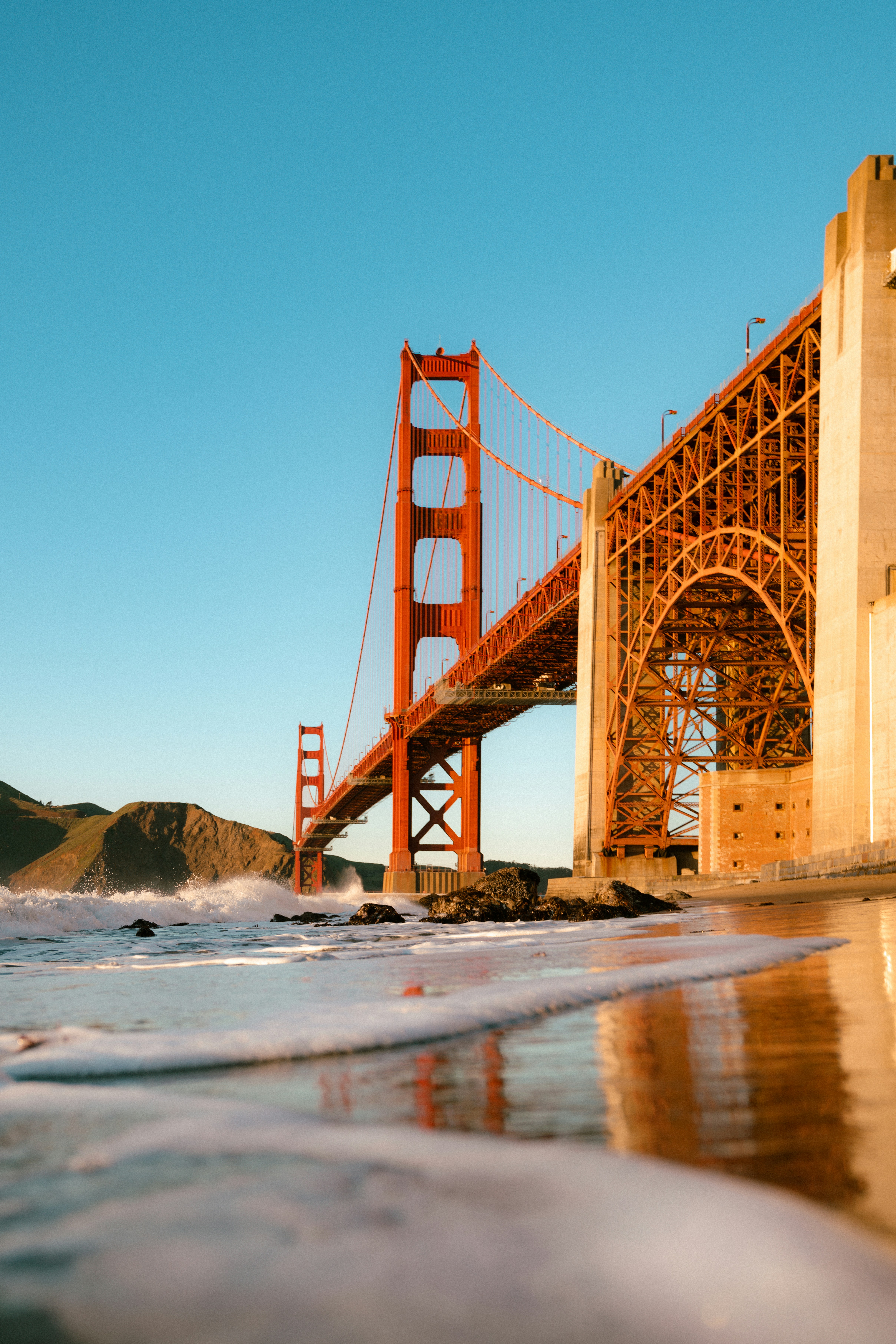 a view of the golden gate bridge from the beach