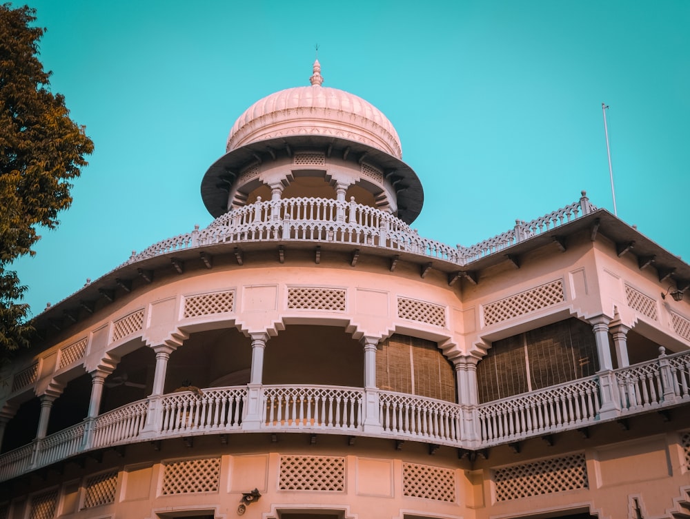 a tall building with balconies on top of it