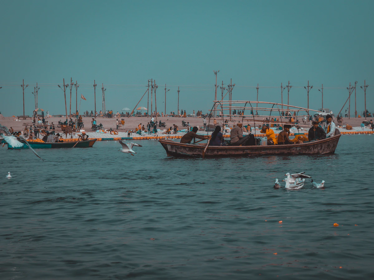 People on boats at the Triveni Sangam in Prayagraj