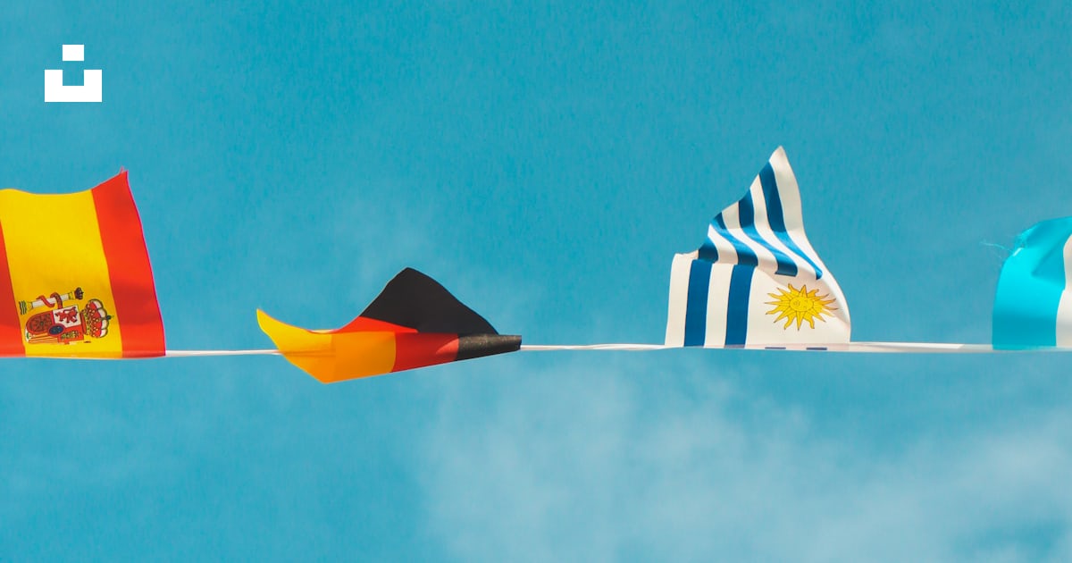 A bunch of flags that are flying in the sky photo – Free Flag Image on ...