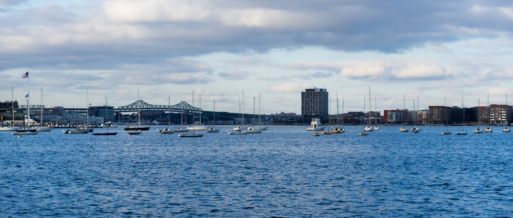 a group of boats floating on top of a large body of water