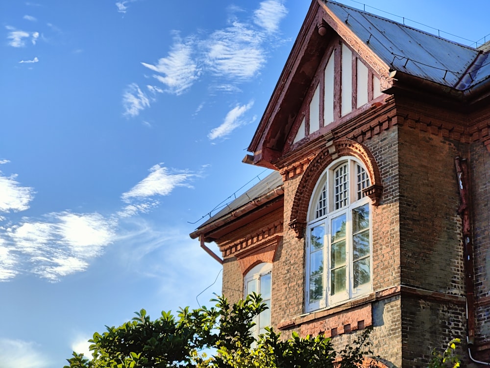 a large brick building with a clock on the front of it