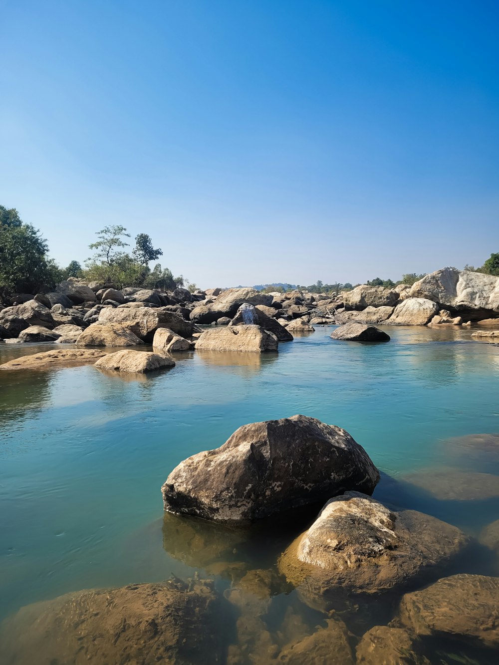 a body of water with rocks in it