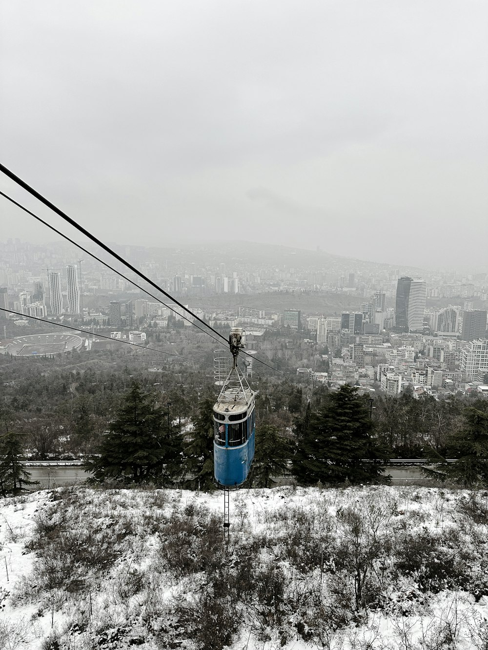 a view of a city from a ski lift