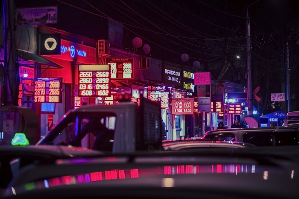 a city street filled with lots of neon signs