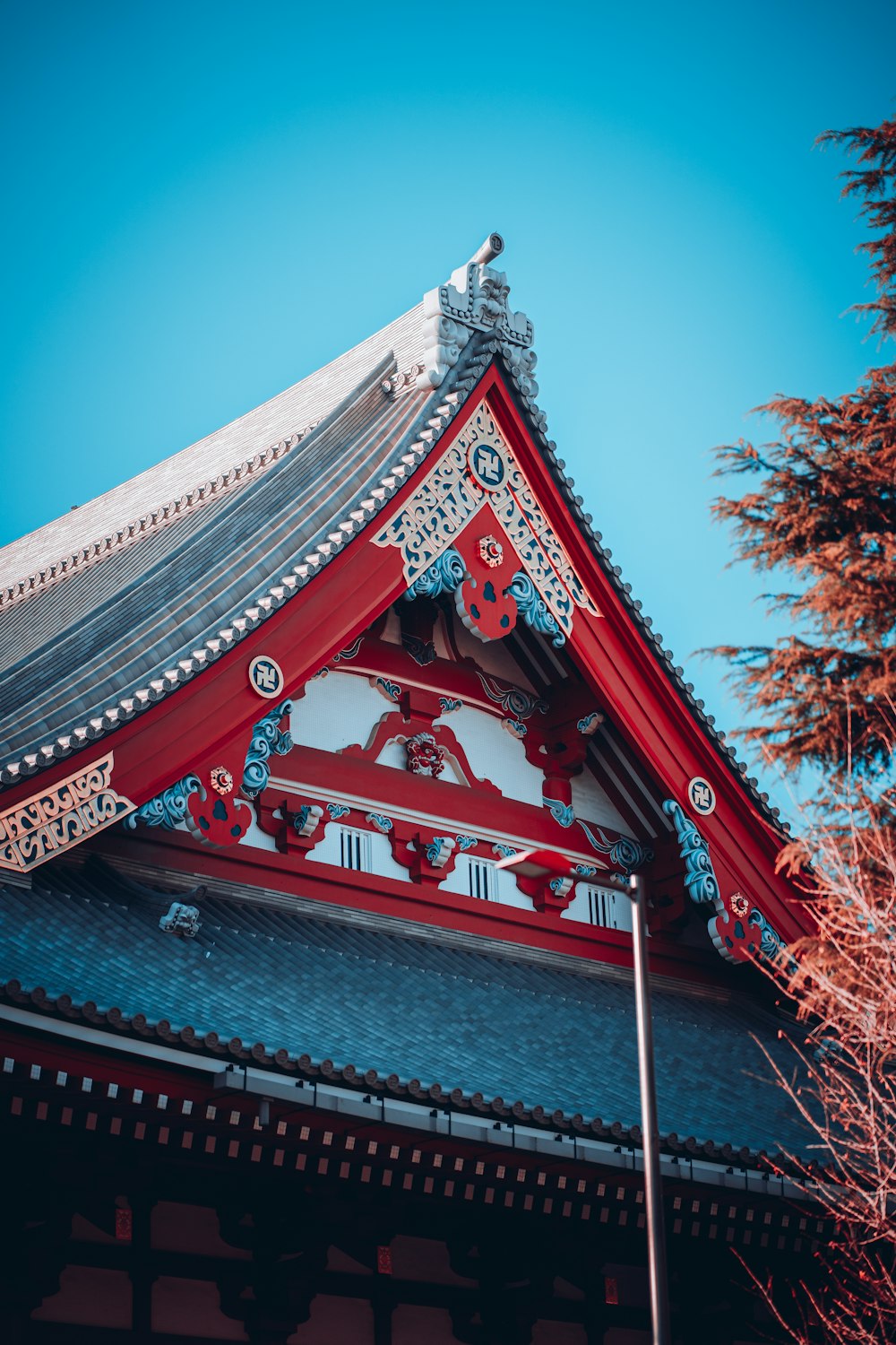 the roof of a building with a blue sky in the background