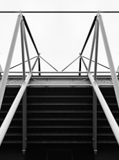 a black and white photo of a metal structure
