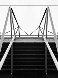 a black and white photo of a metal structure